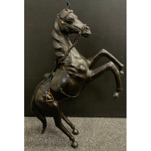 52 - A large leather bound wooden horse, 20th century, 52cm high