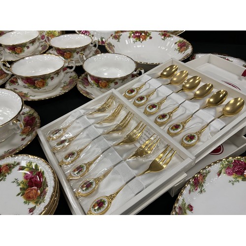 67 - Royal Albert ‘Old Country roses’ table service for eight including; a eight dinner plates, three med... 