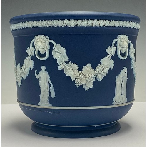 609 - A Wedgwood Jasperware jardinière, sprigged with classical muses amidst garlands of fruiting vine, li... 