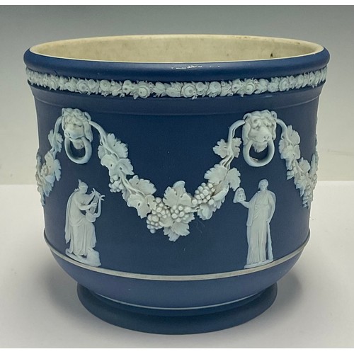 609 - A Wedgwood Jasperware jardinière, sprigged with classical muses amidst garlands of fruiting vine, li... 