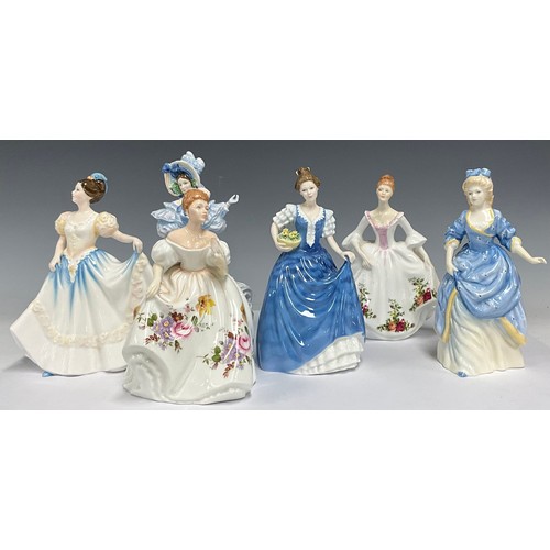 56 - A Royal Doulton figure, Marilyn HN3002, printed in the Posies pattern; others, Country Rose HN3221, ... 