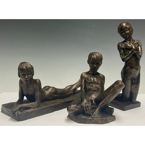 622 - Neil Godfrey, a resin sculpture, reclining nude male, 26cm long, signed, dated 1987; two other simil... 