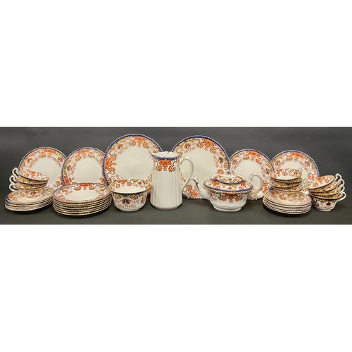 624 - A Staffordshire Imari palette tea set, including teapot, hot water jug and slop bowl, pair of bread ... 