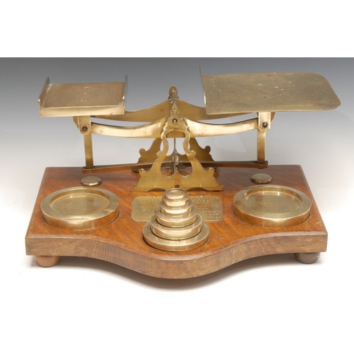 642 - A set of large Victorian oak and brass postal balance scales, the serpentine base with applied plaqu... 