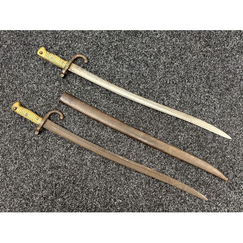 2146 - Pair of French M1866 Chassepot Bayonets, one complete, the other without scabbard. Example with scab... 