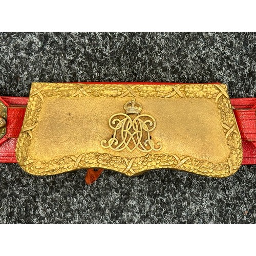 2176 - British Officers Cross Belt and Pouch. Heavy gilt plated lid to the pouch. Red leather backed belt.