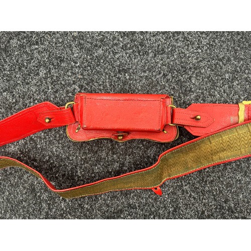 2176 - British Officers Cross Belt and Pouch. Heavy gilt plated lid to the pouch. Red leather backed belt.