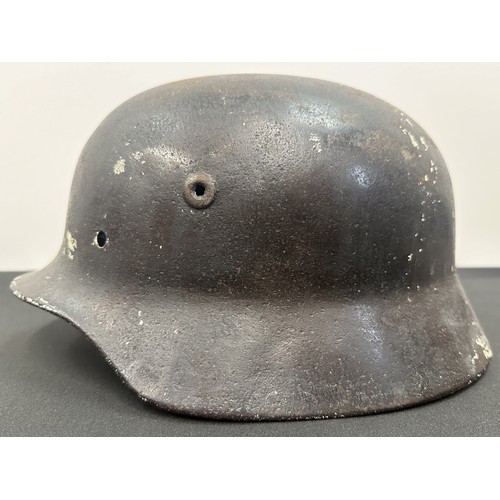 2302 - WW2 Third Reich M40 Pattern Steel Helmet battle damaged Normady relic. Shrapnel damage to the visor ... 