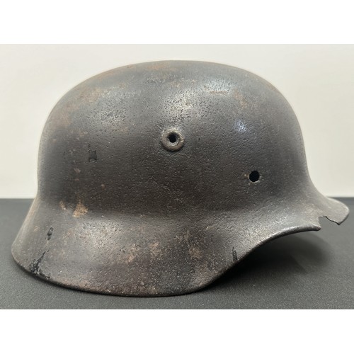 2302 - WW2 Third Reich M40 Pattern Steel Helmet battle damaged Normady relic. Shrapnel damage to the visor ... 