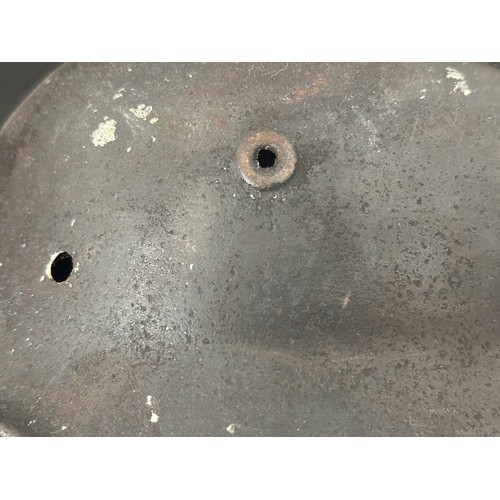 2302 - WW2 Third Reich M40 Pattern Steel Helmet battle damaged Normady relic. Shrapnel damage to the visor ... 