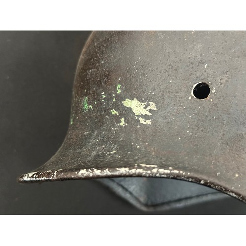 2302 - WW2 Third Reich M40 Pattern Steel Helmet battle damaged Normady relic. Shrapnel damage to the visor ... 