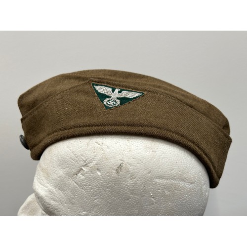 2337 - WW2 Third Reich SA Lagermutze complete with triangular Bevo flatwire eagle insignia with green backi... 