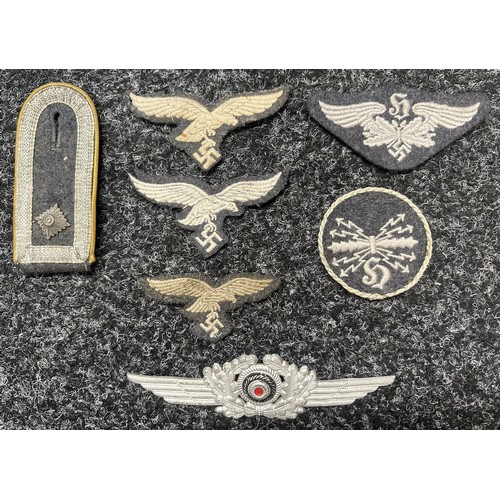 2349 - WW2 Third Reich Luftwaffe insignia collection to include: Two uniform removed breast eagles: Uniform... 