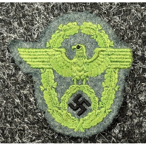 2351 - WW2 Third Reich Schuma Battalion Bevo Cap Insignia, uncut: Police sleeve eagle, uniform removed. (2)