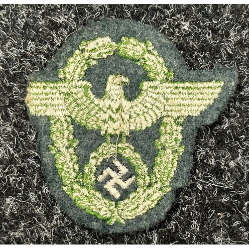 2351 - WW2 Third Reich Schuma Battalion Bevo Cap Insignia, uncut: Police sleeve eagle, uniform removed. (2)