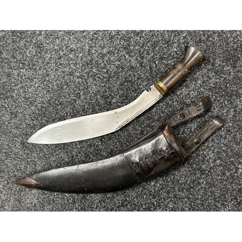 2388 - Gurhka Kukri knife with single edged blade 290mm in length. Horn grip. Overall length 400mm. Brass c... 