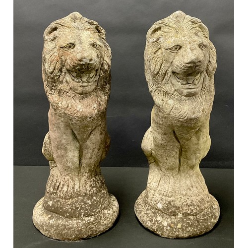 666 - A pair of lion garden ornaments