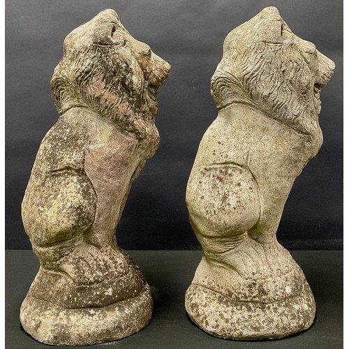 666 - A pair of lion garden ornaments