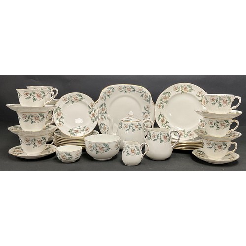 678 - A Crown Staffordshire tea set, printed with blossom, including small teapot, milk and sugar, cream a... 