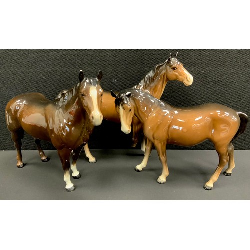 24 - Beswick Quarter Horse, brown gloss, 20cm high, another, Beswick Bay Horse, 17cm high (3)