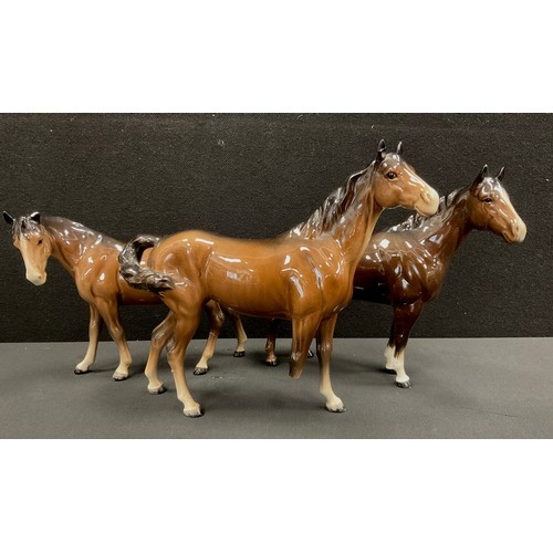 24 - Beswick Quarter Horse, brown gloss, 20cm high, another, Beswick Bay Horse, 17cm high (3)