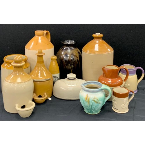 34 - Stoneware including; flagons, jars, animal feeders, Brewed ginger beer C.W.Southern Belper bottle, B... 