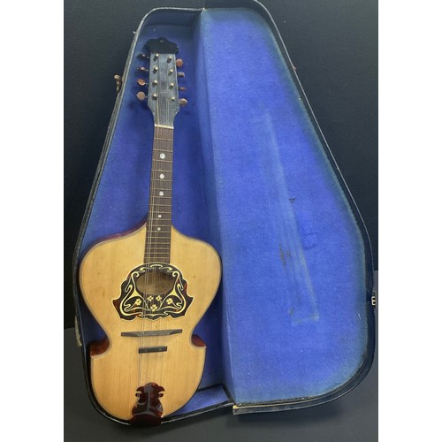 43 - An early 20th century Lyre shaped flatback mandolin, cased,. c.1910