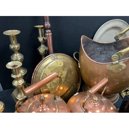 61 - Brass and copper including a copper scuttle, kettles; arts and crafts copper chamberstick and dish, ... 