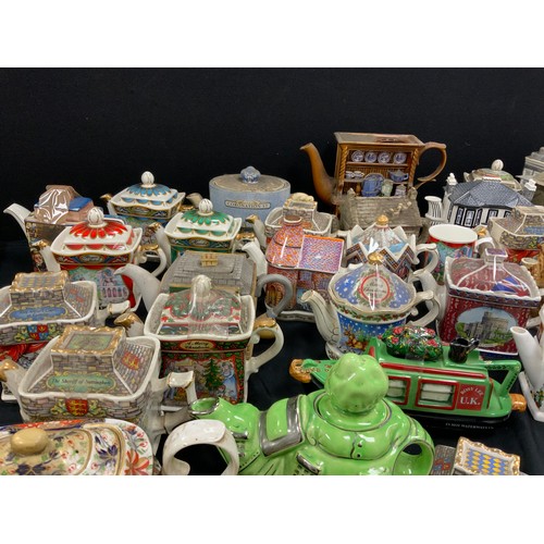 68 - Novelty tea pots including; Faulty Towers, Coronation Street, Sadler; others (approx.25)