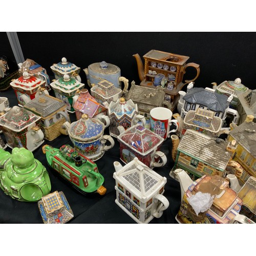 68 - Novelty tea pots including; Faulty Towers, Coronation Street, Sadler; others (approx.25)