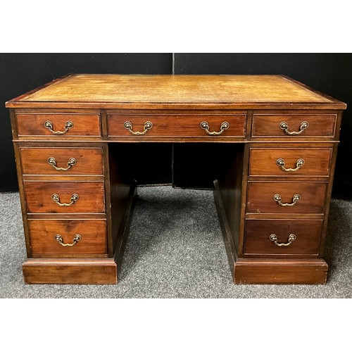 99 - An early 20th century mahogany pedestal desk, tooled leather writing surface, four short drawers to ... 