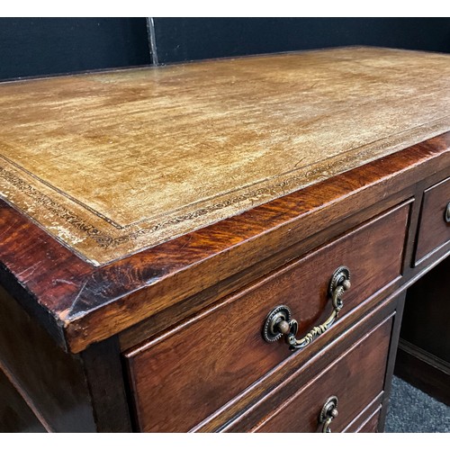 99 - An early 20th century mahogany pedestal desk, tooled leather writing surface, four short drawers to ... 