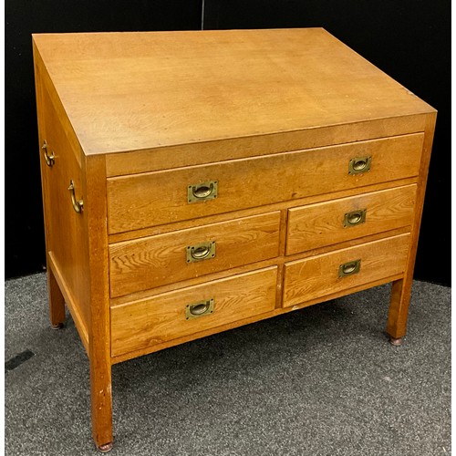 113 - An early 20th century oak draughtsman's or Lectern chest, having a single long drawer, above four sh... 