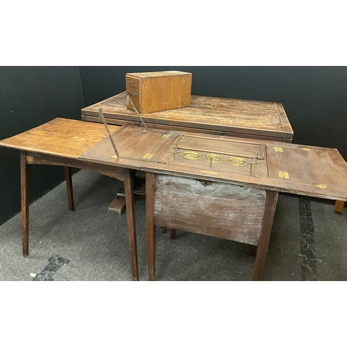 118 - An early 20th century pop-up drinks/liquor cabinet;  stained pine plank top side table;  distressed ... 