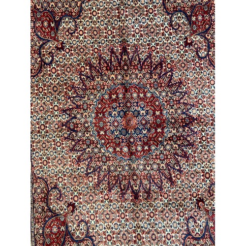 120 - A North East Persian Moud Carpet central medallion, multi-tone field, 295cm x 215cm