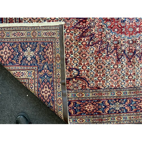 120 - A North East Persian Moud Carpet central medallion, multi-tone field, 295cm x 215cm