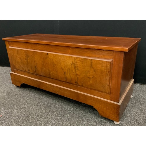 121 - A walnut and mahogany blanket chest, 56cm high x 125cm wide x 47cm deep.