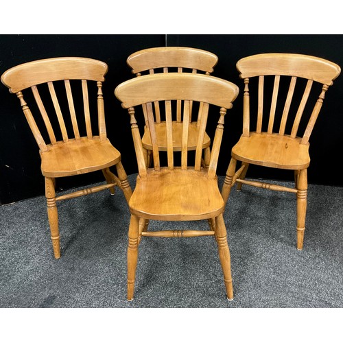 124 - A set of four beech dining chairs, (4).