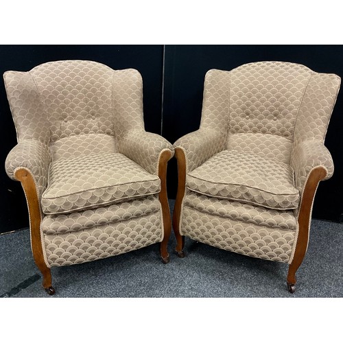 128 - A Pair of Edwardian stained beech wing-back armchairs, 95cm high (47cm to seat) x 71cm wide x 71cm d... 