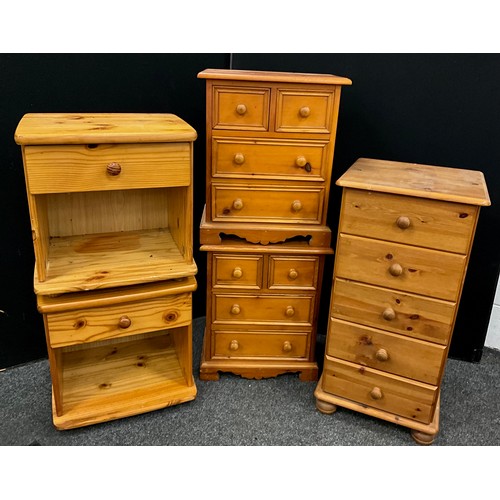 134 - A pair of pine bedside chests / cabinets, each with a pair of small drawers above two short drawers,... 