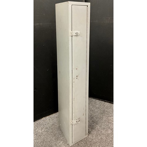 135 - A metal floor standing Gun cabinet, with internal lockable ammunition compartment, 148cm high x 23cm... 