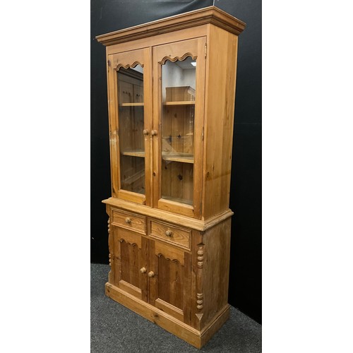 137 - A Victorian style pine bookcase cabinet, 198cm high x 91.5cm wide x 39.5cm deep.