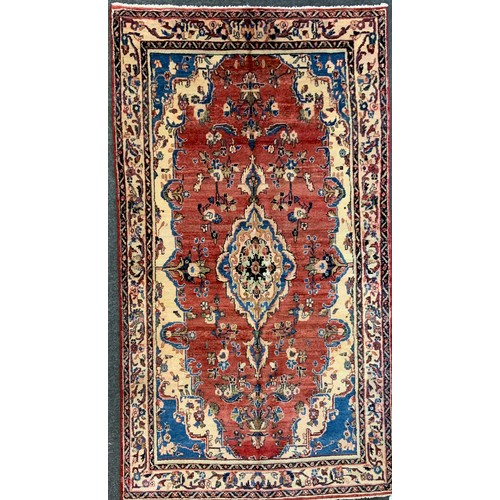 139 - A North West Persian Mahal Rug, in tones or cream, blue, red and yellow, 245cm x 140cm