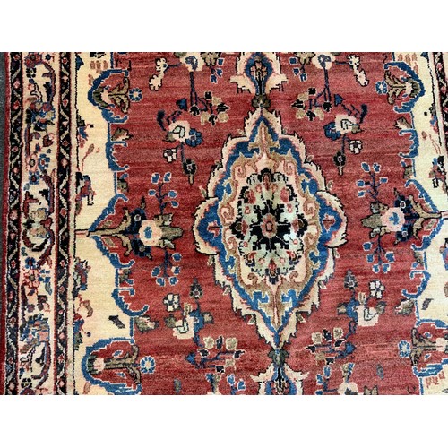 139 - A North West Persian Mahal Rug, in tones or cream, blue, red and yellow, 245cm x 140cm