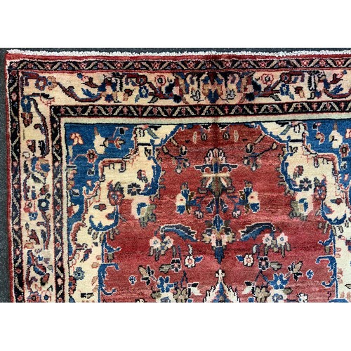 139 - A North West Persian Mahal Rug, in tones or cream, blue, red and yellow, 245cm x 140cm