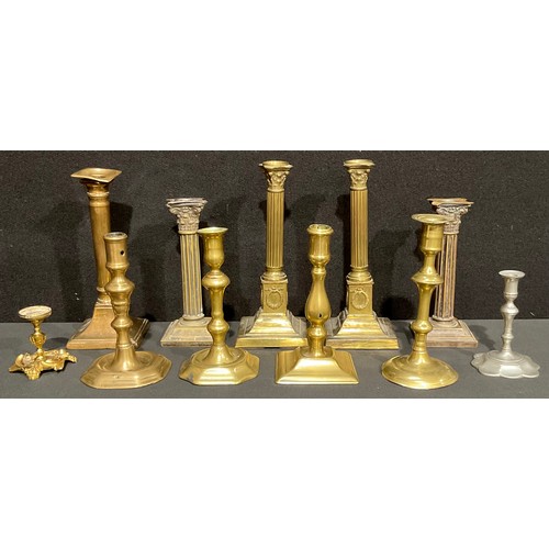 67 - A pair of 19th century French Empire brass candlesticks, as Corinthian columns, laurel wreaths to pl... 