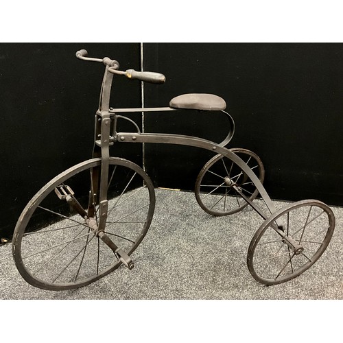 158 - A replica wrought iron framed tricycle, wooden hubs 79cm high