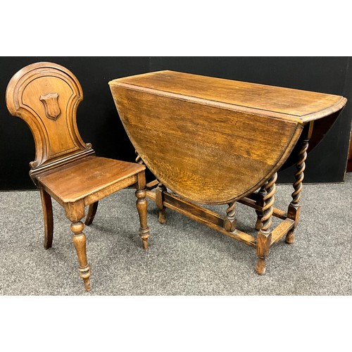 160 - A 19th century shield-back hall chair, and an oak drop-leaf table, 75cm high x 107cm x 43cm (142cm e... 