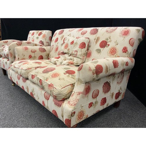 173 - A mid century design two seat sofa and conforming pair of tub armchairs, the sofa measuring 85cm hig... 