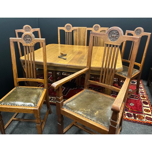 180 - An early 20th century oak dining suite, golden oak canter rectangular wind-out dining table and two ... 